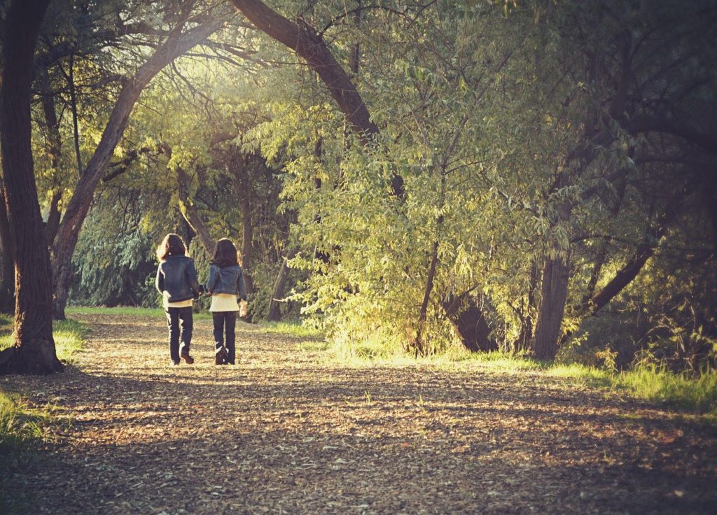 two friends holding hands