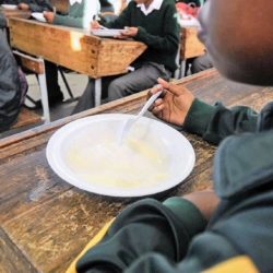 A child eats a meal at school