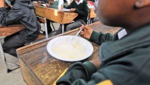 A child eats a meal at school