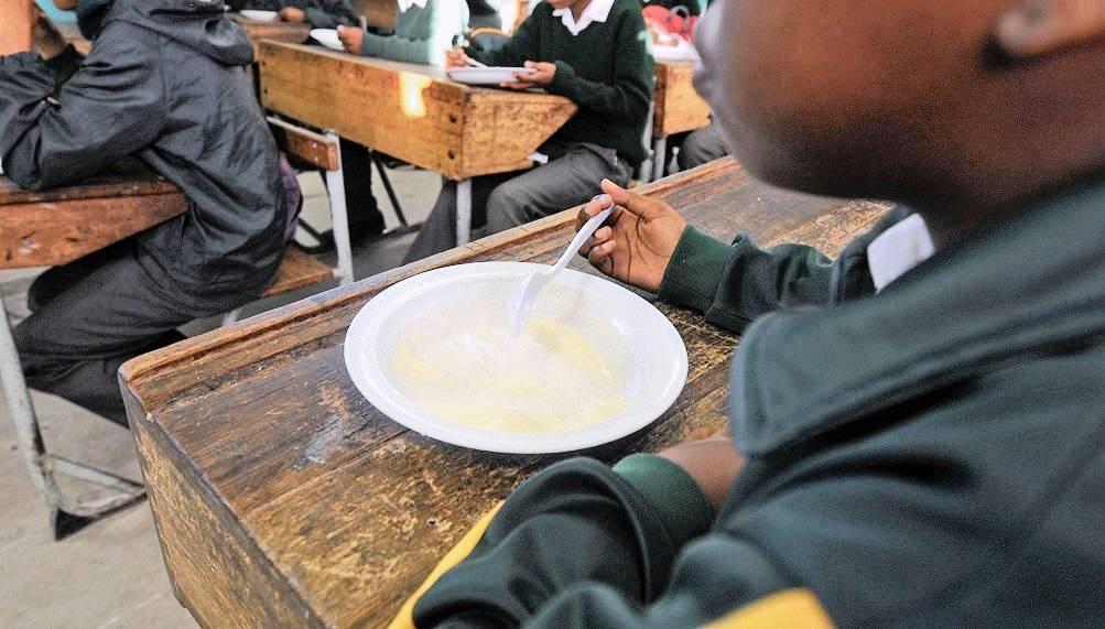 A child eats a meal at school