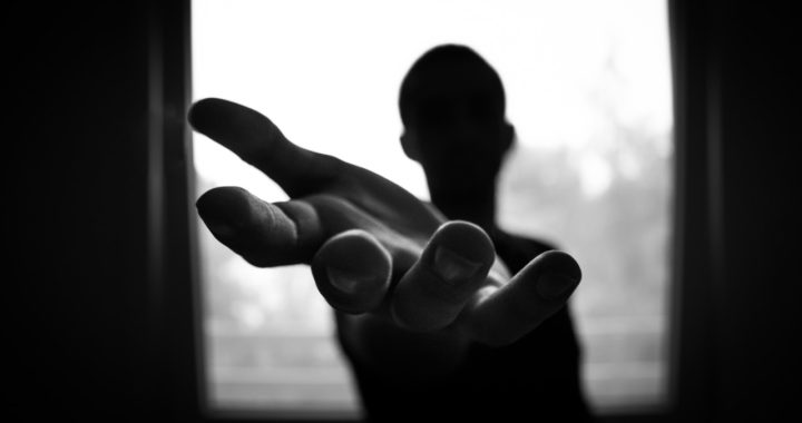 teenager stretching his hands for help