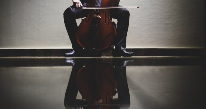 A boy plays the cello.