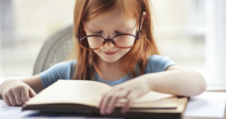 a child reading a book.